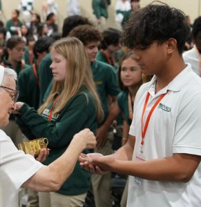 Sophomores Jackson Duvitch and Daria Pereira receive Communion during ILS’s Welcome Back Mass on Thursday, September 3rd.