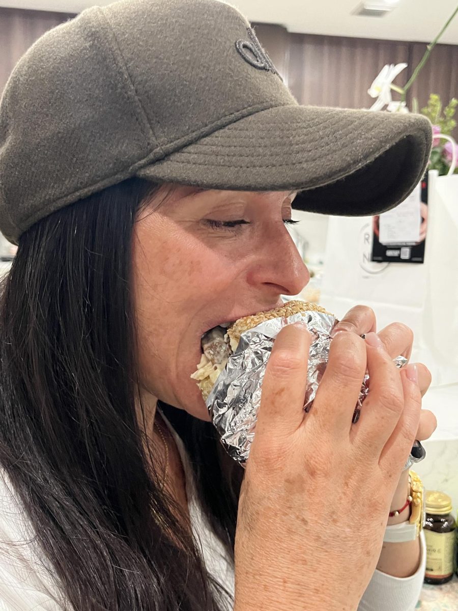 ILS sophomore parent Sandra Jordan indulges in a Le Rond burger.