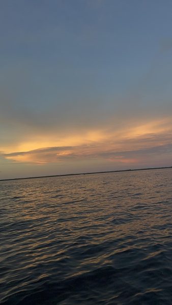 The setting sun reflects over Miami’s warm waters as extreme heat continues to impact the city.