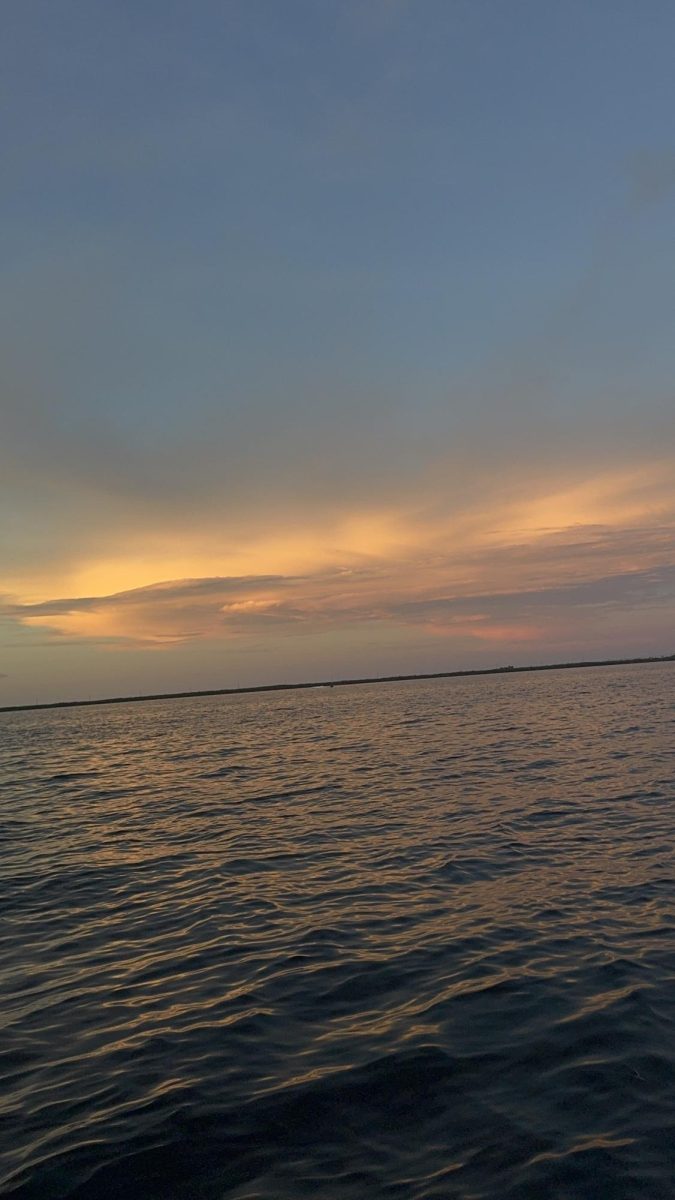 The setting sun reflects over Miami’s warm waters as extreme heat continues to impact the city.