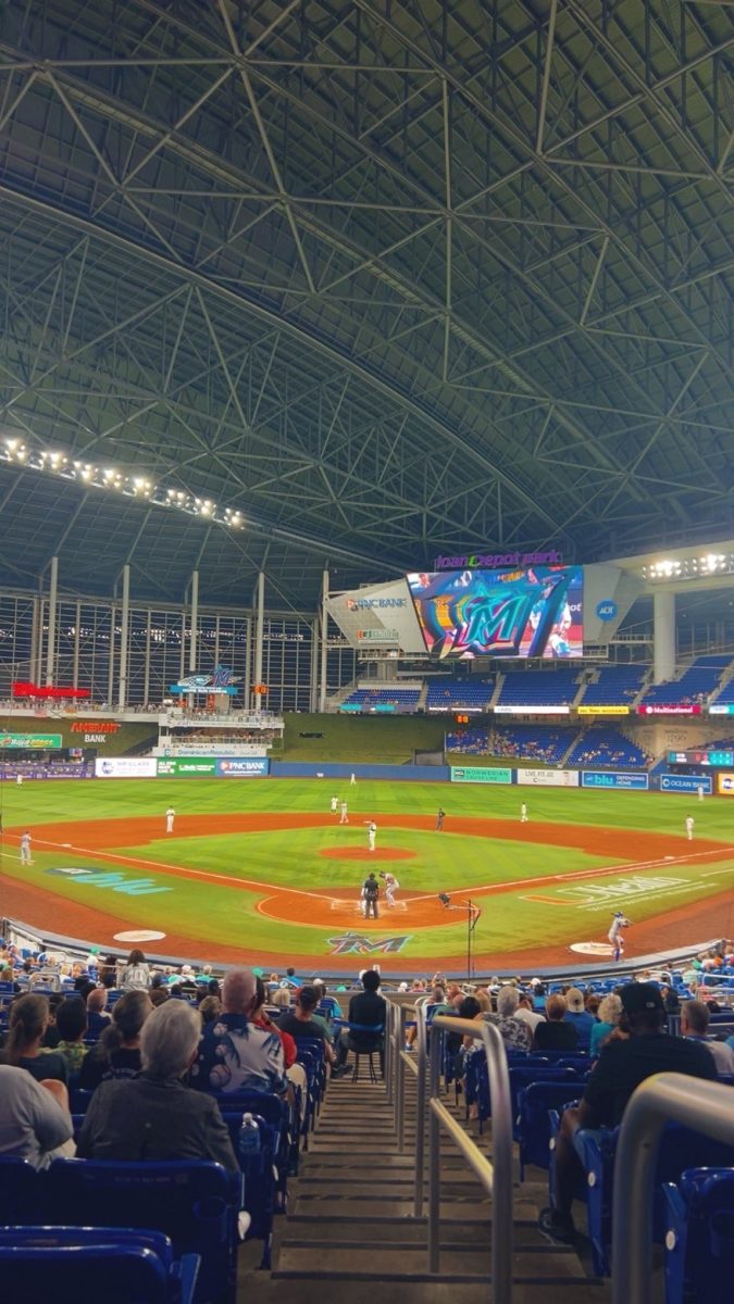 Baseball players are get set as they stand waiting for the game to start.