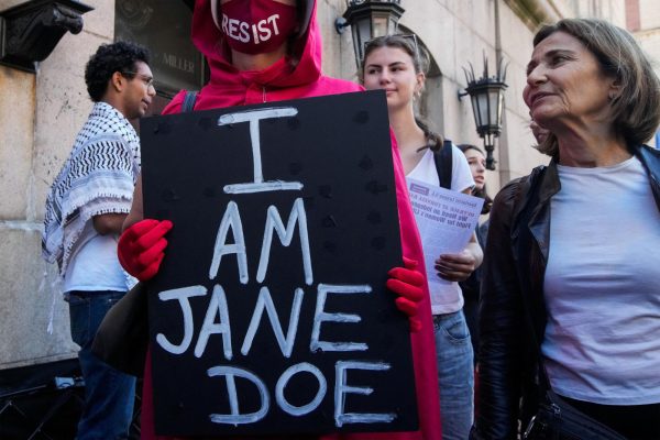 Demonstrators rally outside the Columbia University during a Stop Sexual Violence protest as part of US rallies being held in the wake of the Cornell University rape allegations, in New York City, US, October 8, 2026. REUTERS/Eduardo Munoz