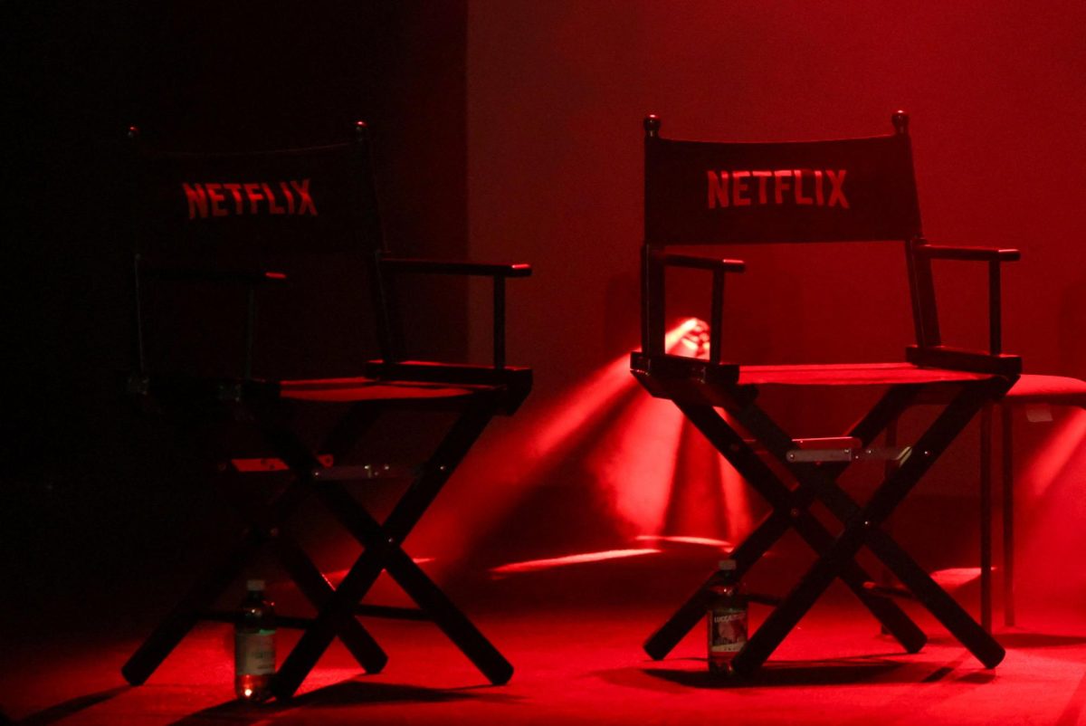 Two director's chairs wth Netflix logo sit on a stage in Lucca, Italy, October 31, 2025. Netflix is the platform which just released the Lizzie Borden true crime story just in time for the Halloween holiday. REUTERS/Claudia Greco