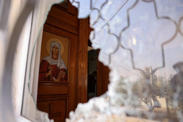 A shattered window at Saint George’s Greek Orthodox Church, where gunmen opened fire during a funeral the previous day, in the village of Hamoud, Karak, Jordan, October 24, 2026. REUTERS/Alaa Al Sukhni TPX IMAGES OF THE DAY