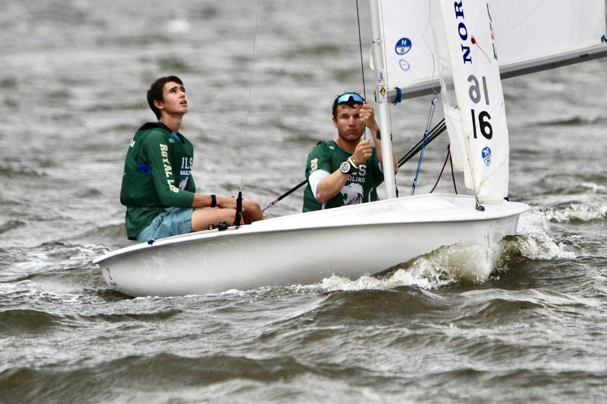 Alejandro Escudero and a fellow sailor brave the wind and waves at a recent Sailing team competition.