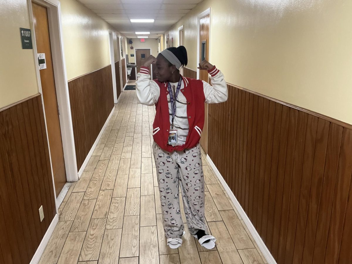 Freshman Joceline Francois represents the tacky spirit by wearing a letterman jacket and Hello Kitty pants.