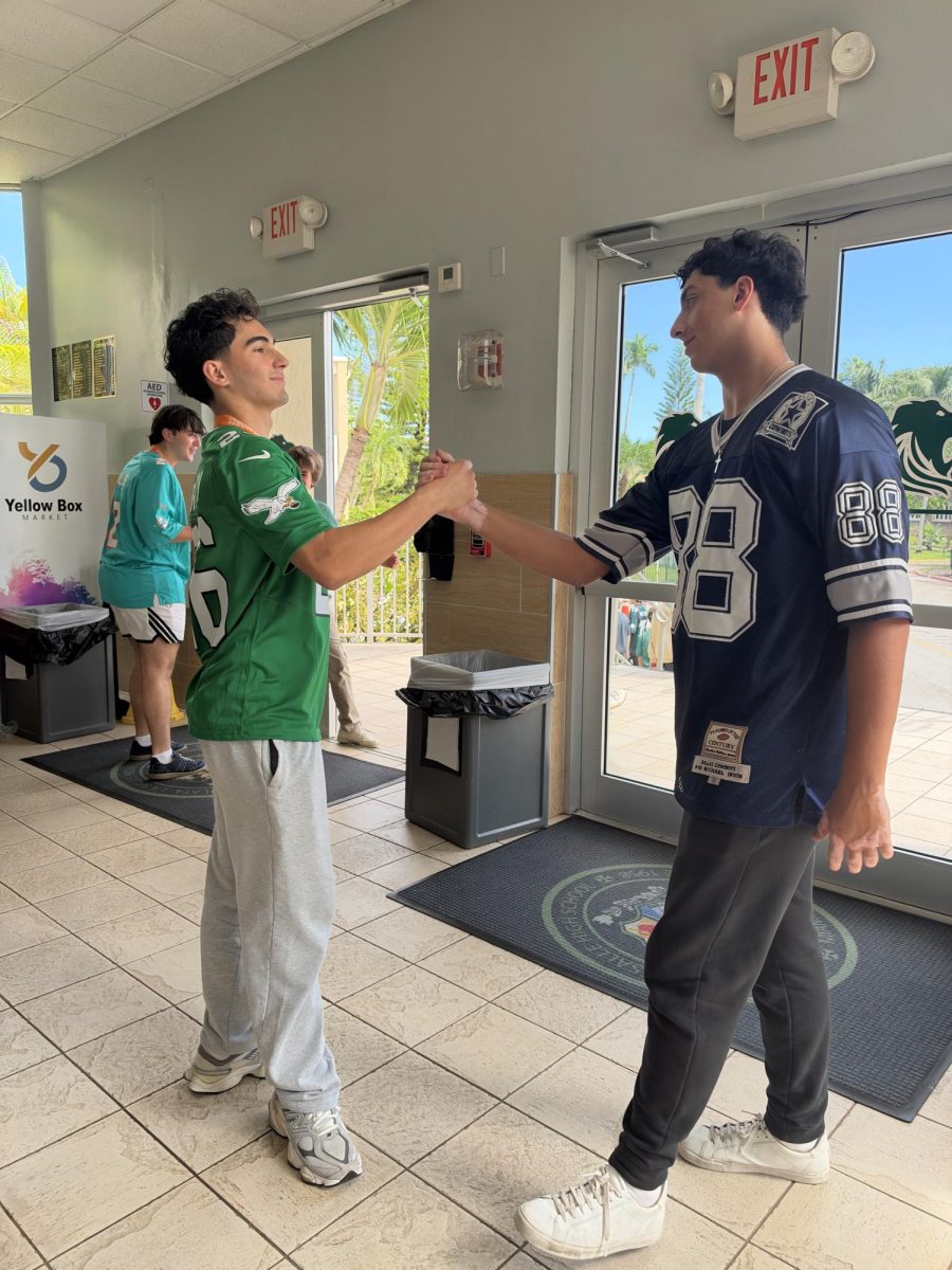 Sophomores Marc De La Cruz and Julian Alvarez dab each other up before leaving school after the entertaining Homecoming skits.