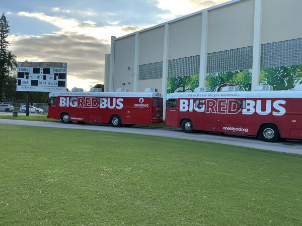 The big red busses are lined up on the track in front of the gym awaiting donations from Royal Lions.