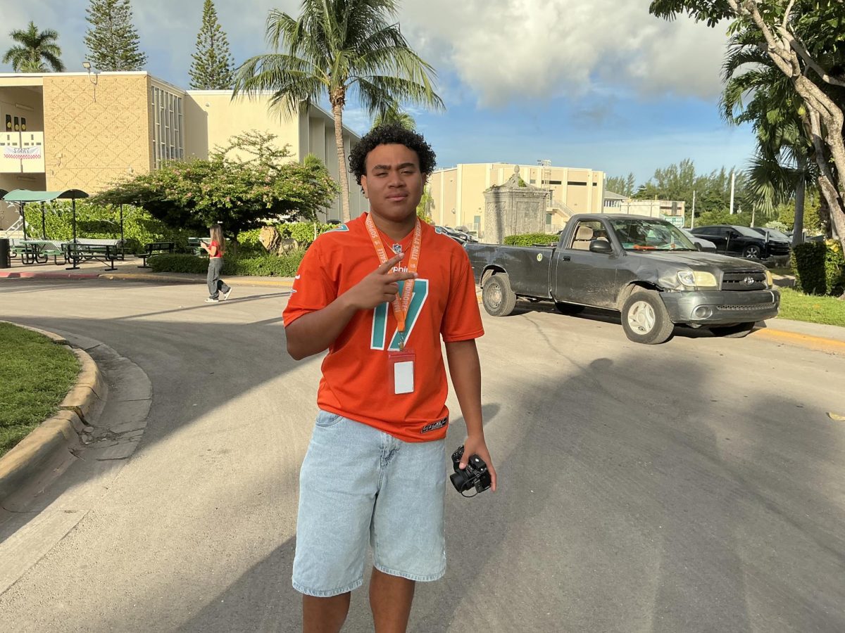 This sophomore, John McCroy, is happy showing off his Dolphins' pride.