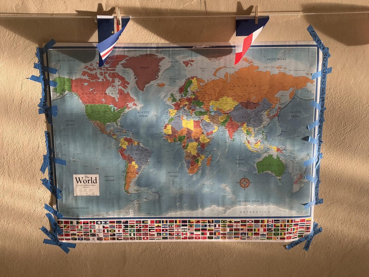 Juniors hang a world map celebrating their World Cup theme.