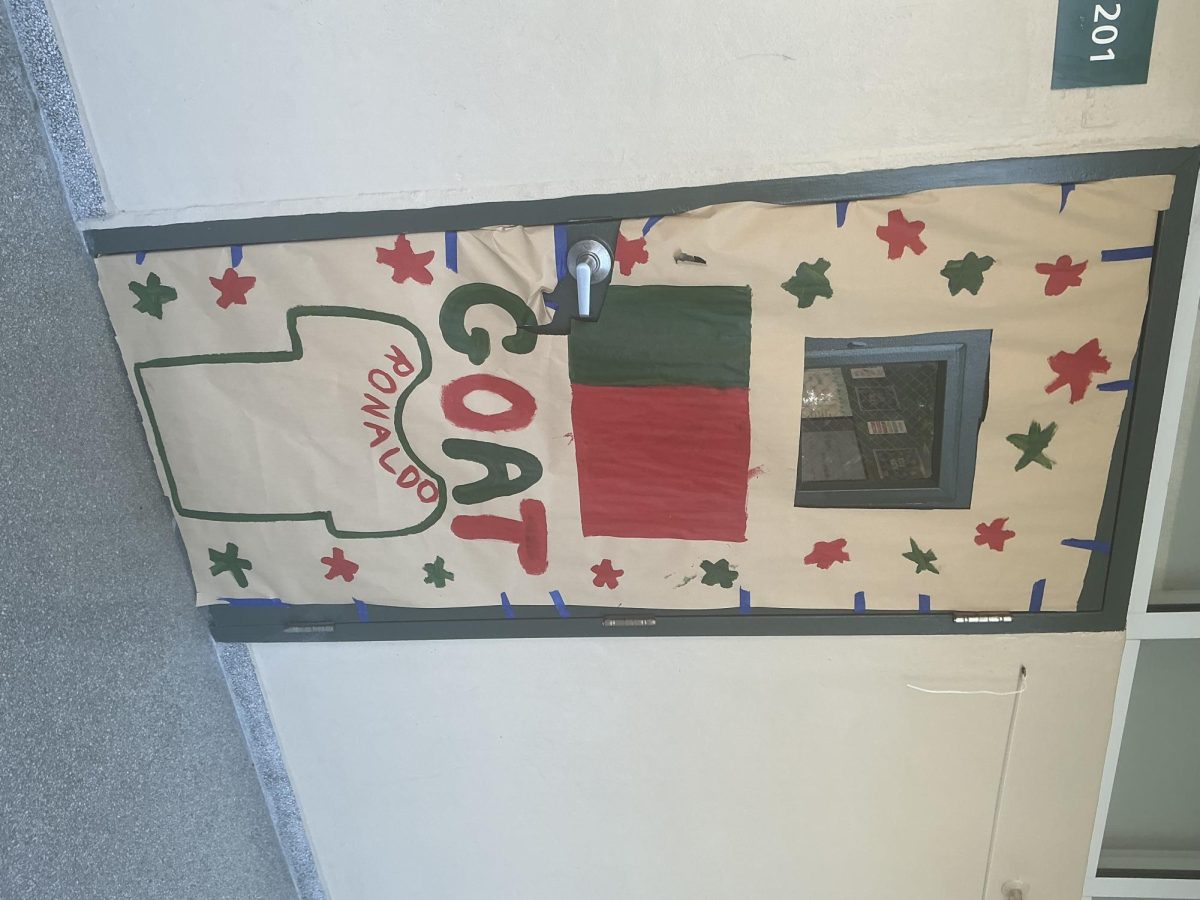 Room 201 decorated with a simplified Portuguese flag and a shirt with Ronaldo on the back.