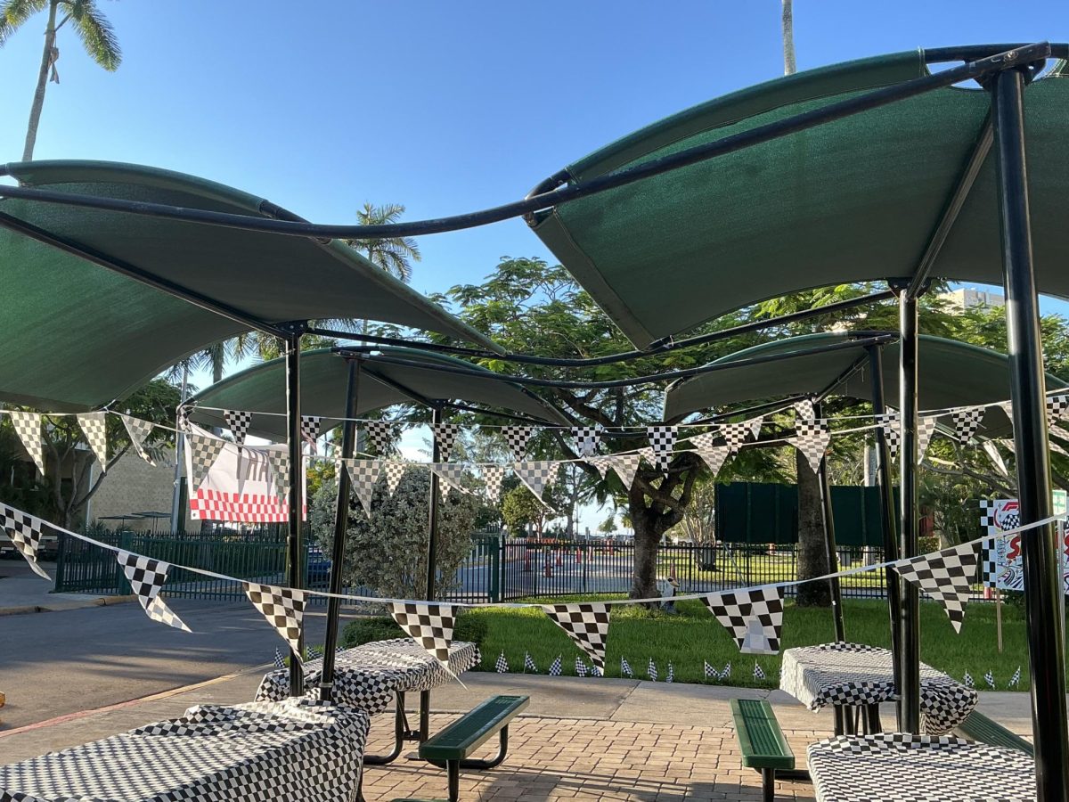 Checkered flags, table covers, and decorations transform the outside of the 400 building.