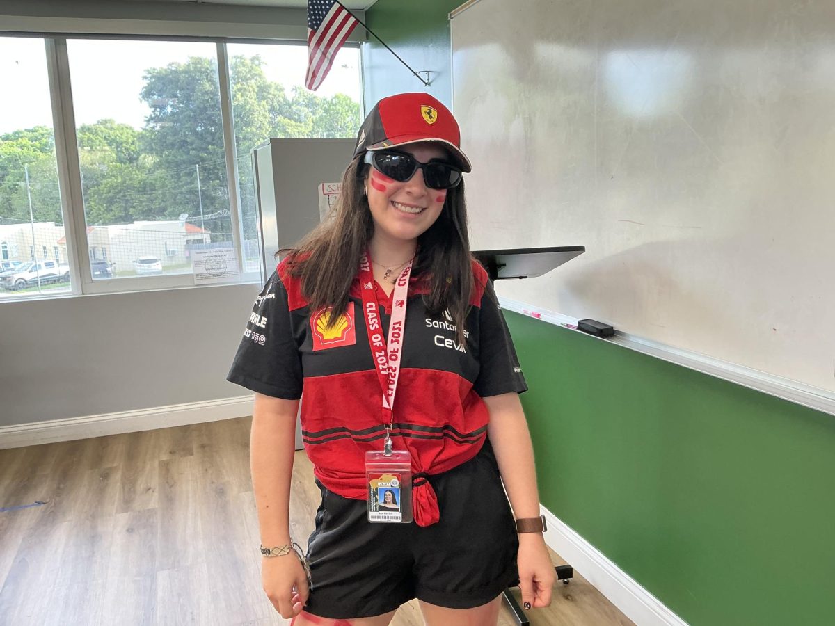 Senior Ana Fede Herian prepares for Pep Rally wearing a Ferrari outfit. 