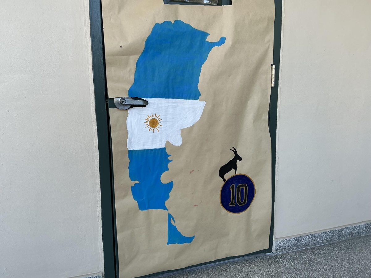 Argentina’s map and flag next to a goat drawing refers to Lionel Messi as the greatest player of all time in the FIFA World Cup Junior themed building. 