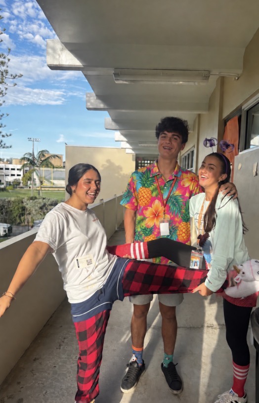 Sophomores Antonella Rodriguez, Enrique Partida, and Rebecca Edlund show off plaid pants and unicorn slippers for Tacky Tuesday.