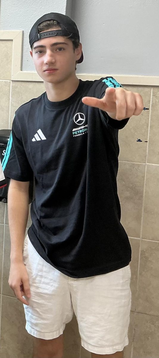This senior is showing off his Mercedes F1 shirt as a big fan during Hoco week.