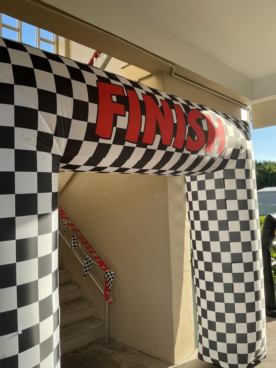 Racers cross the finish line, celebrating achievement, speed, and success.