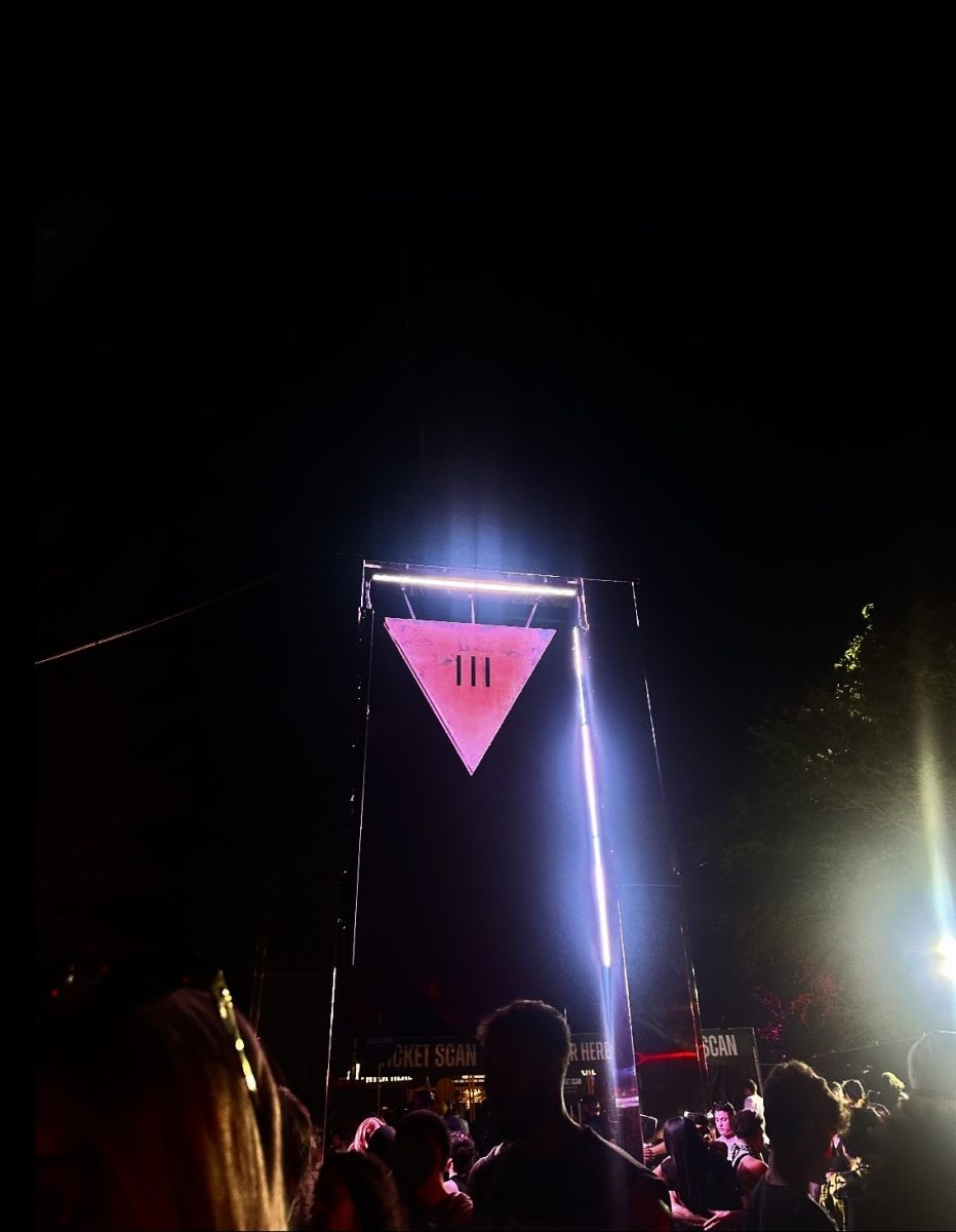 Fans gather around the III Points sign, celebrating Miami’s exciting music festival.