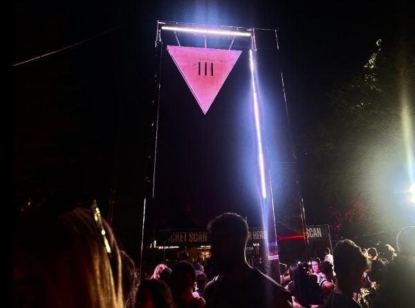 Fans gather around the III Points sign, celebrating Miami’s exciting music festival.