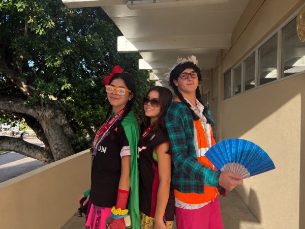 Seniors Gabriela Punzo, Valentina Esperante, and Sebastian Castro celebrate Tacky Tuesday.