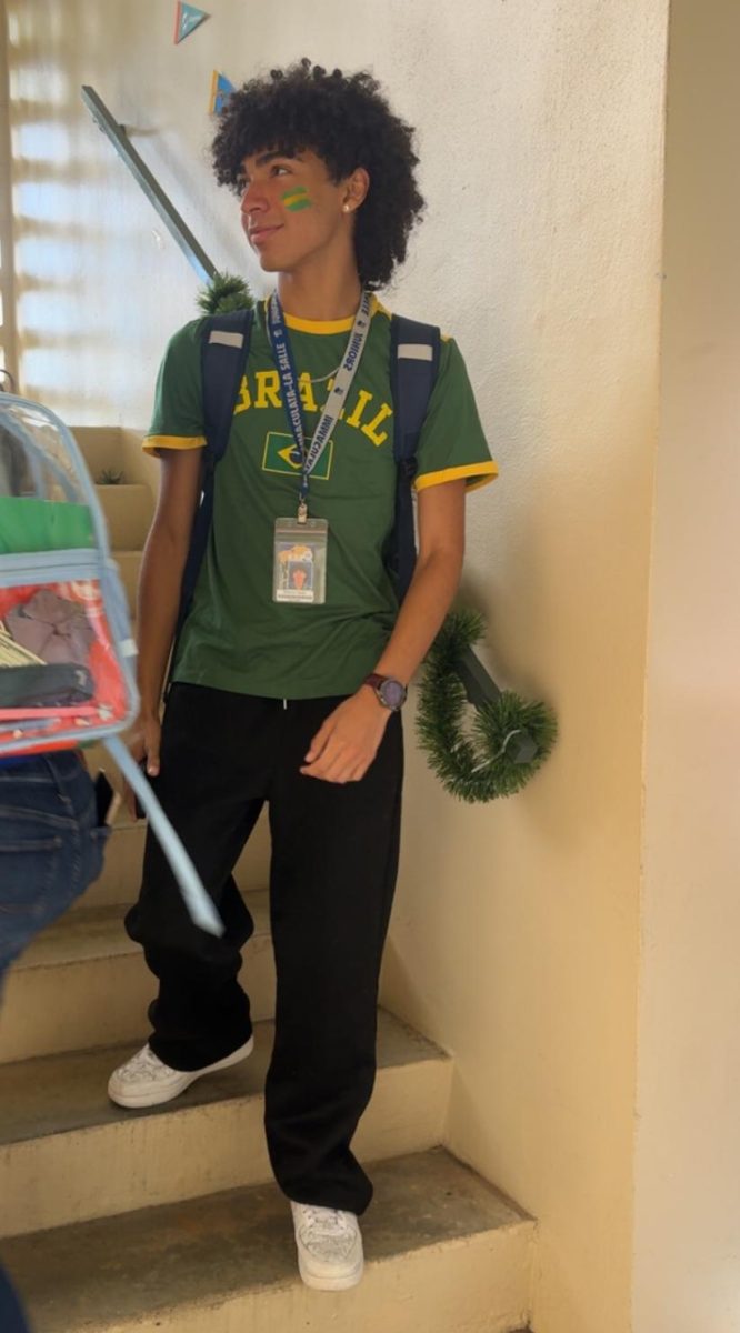 Junior Antonio Tejada wears a Brazil jersey with matching face paint to represent the junior class’s World Cup theme. 