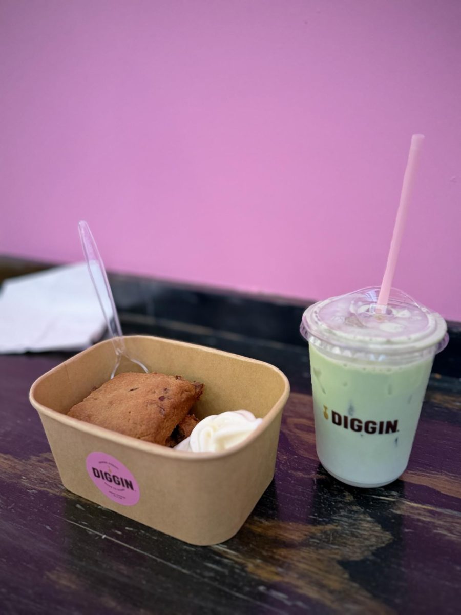 A warm cookie paired with a scoop of cold milk flavored ice cream, along with a iced matcha latte to go with the treat.