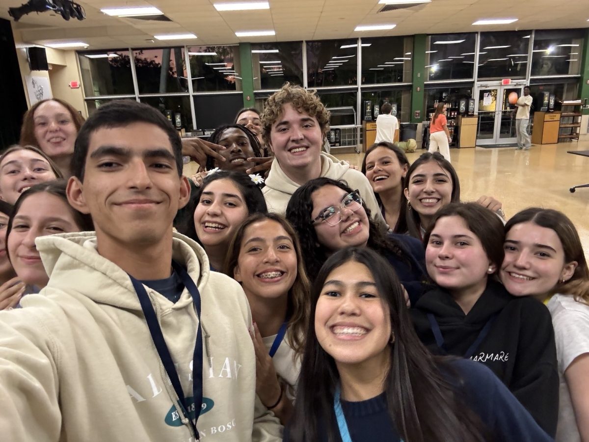 Students come together for a group selfie, celebrating their friendship and memories they made throughout their time at ETC.